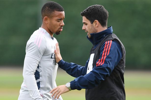 Arsenal manager Mikel Arteta talks to Gabriel Jesus during a training session at London Colney on September 27, 2022 in St Albans, England.